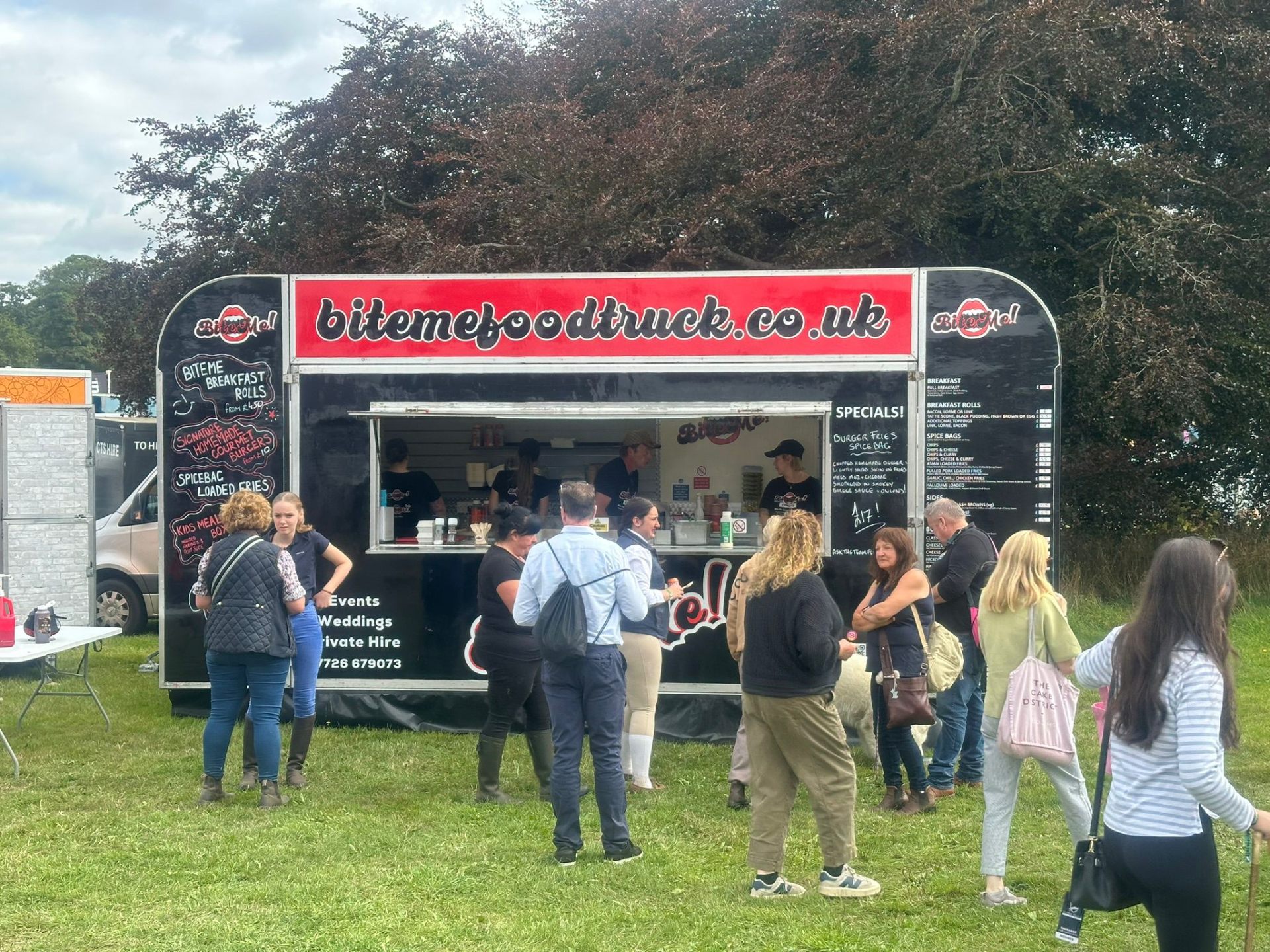 Bite Me food truck with queuing customers at an event