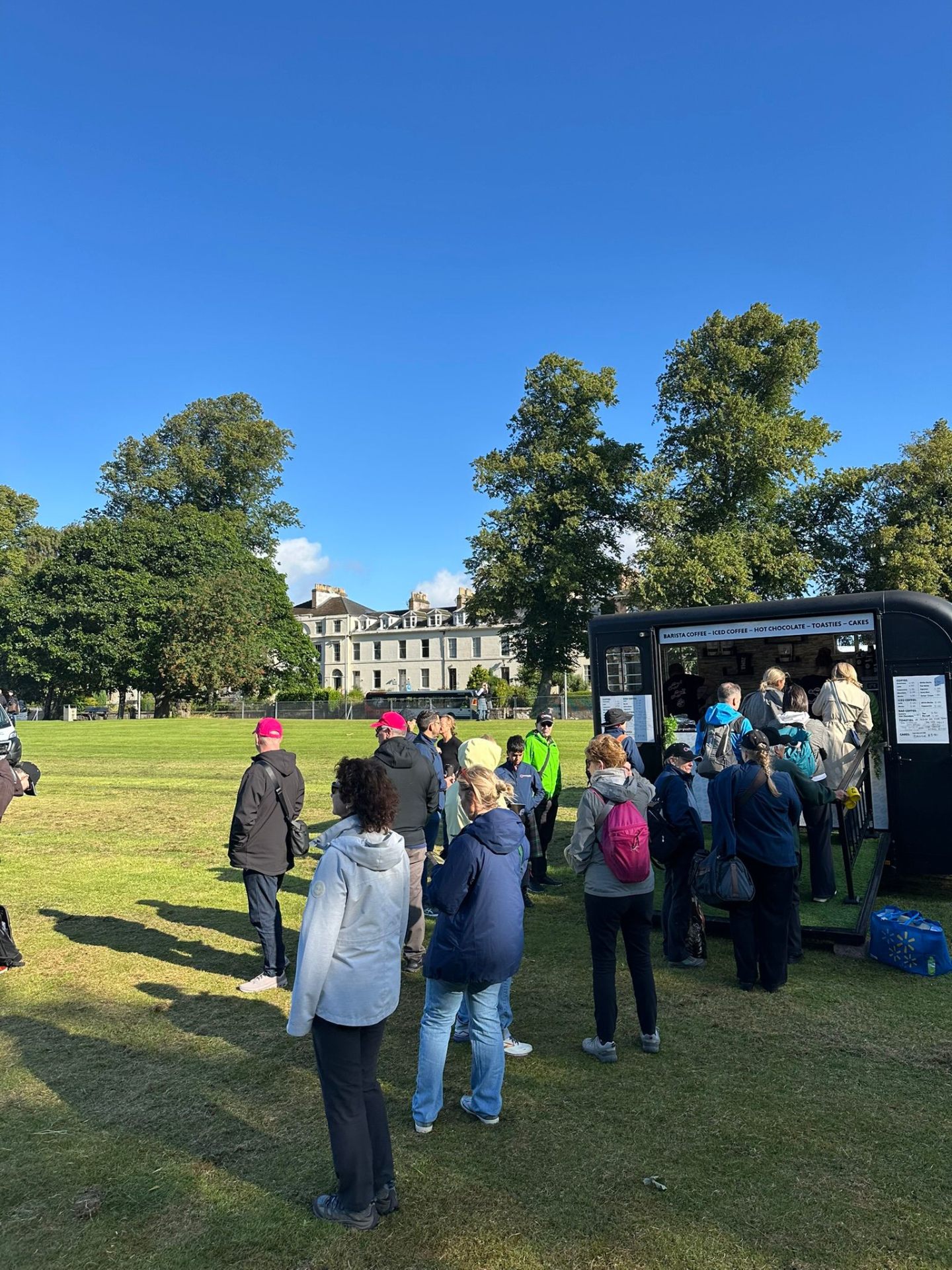Queue at Fuel Me coffee trailer in the park